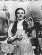 Still of Judy Garland as Dorothy Gale. 1939's The Wizard of Oz uses black and white film for the nostalgic Kansas scenes and technicolor for the Land of Oz. (Image courtesy of Wikimedia Commons)