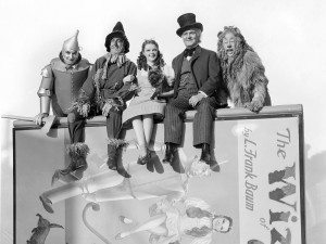 The gang's all here! From left: Jack Haley as the Tin Man, Ray Bolger as the Scarecrow, Judy Garland as Dorothy Gale, Frank Morgan as the Wizard of Oz, and Bert Lahr as the Cowardly Lion in Victor Fleming's 1939 film adaptation of Baum's book. (Image courtesy of Photosofwar.net)